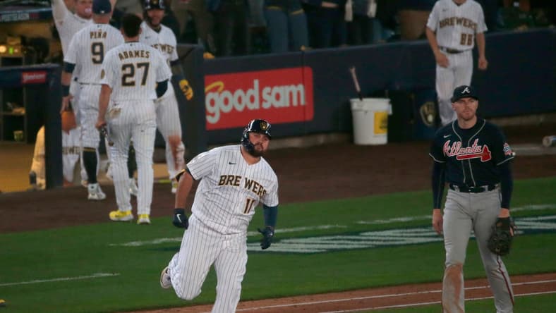 Milwaukee Brewers first baseman Rowdy Tellez (11) rounds first after hitting a two-run homer during the seventh inning of their National League Division Series game against the Atlanta Braves Friday, October 8, 2021 at American Family Field in Milwaukee, Wis.MARK HOFFMAN/MILWAUKEE JOURNAL SENTINEL

Mjs Brewers09 12 Jpg Brewers09