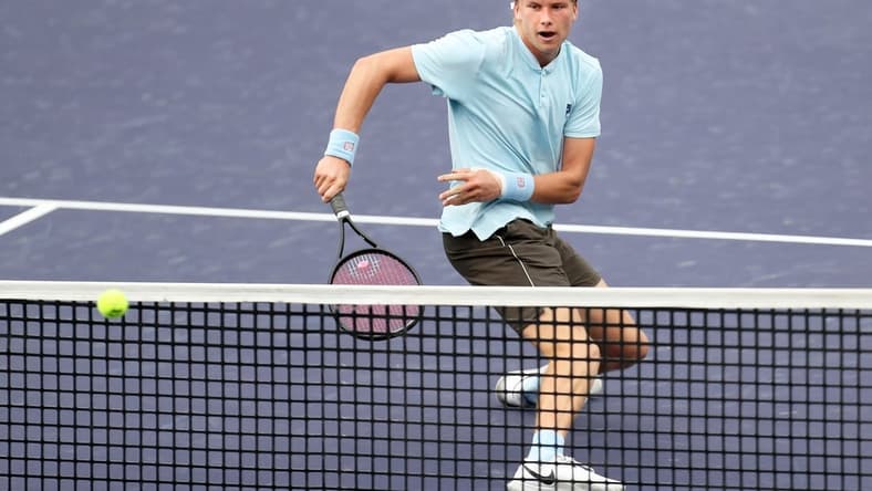 American Jenson Brooksby returns a shot to Cem Ilkel of Turkey on Stadium One at the BNP Paribas Open in Indian Wells, Calif., on October 8, 2021. Brooksby won in two sets.

Jenson Brooksby Vs Cem Ilkel Bnp Paribas2050