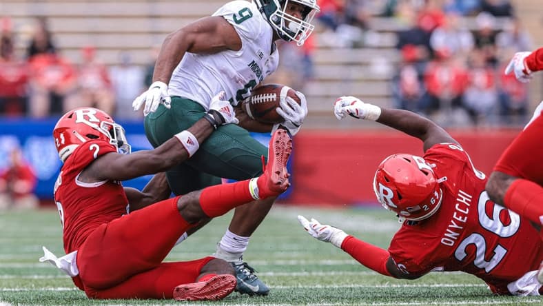 Oct 9, 2021; Piscataway, New Jersey, USA; Michigan State Spartans running back Kenneth Walker III (9) is tackled by Rutgers Scarlet Knights defensive back Avery Young (2) and defensive lineman CJ Onyechi (26) during the second half at SHI Stadium. Mandatory Credit: Vincent Carchietta-USA TODAY Sports