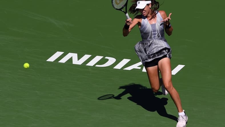 Oct 9, 2021; Indian Wells, CA, USA; Ajla Tomljanovic (AUS) hits a shot against Garbine Muguruza (ESP) at Indian Wells Tennis Garden. Mandatory Credit: Orlando Ramirez-USA TODAY Sports