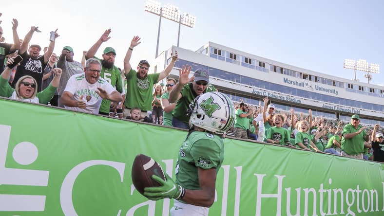 Oct 9, 2021; Huntington, West Virginia, USA; Marshall Thundering Herd wide receiver Shadeed Ahmed (0) celebrates with fans after catching a touchdown pass during the first overtime against the Old Dominion Monarchs at Joan C. Edwards Stadium. Mandatory Credit: Ben Queen-USA TODAY Sports