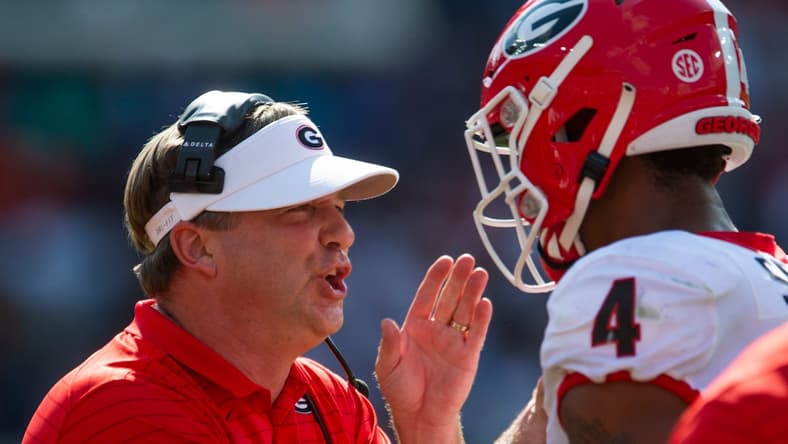 Georgia Bulldog head coach Kirby Smart works with outside linebacker Nolan Smith (4) against the Auburn Tigers at Jordan-Hare Stadium in Auburn, Ala., on Saturday, Oct. 9, 2021.

Auga05