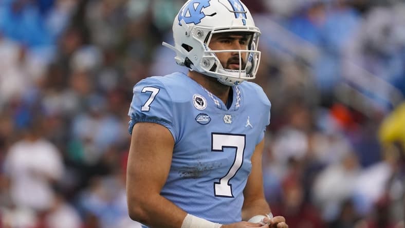 Oct 9, 2021; Chapel Hill, North Carolina, USA;  North Carolina Tar Heels quarterback Sam Howell (7) looks on during the game agains the Florida State Seminoles at Kenan Memorial Stadium. Mandatory Credit: James Guillory-USA TODAY Sports