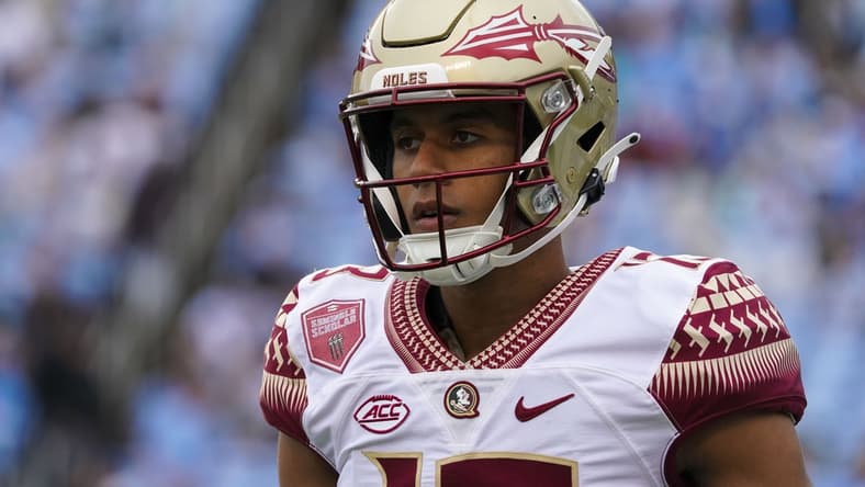 Oct 9, 2021; Chapel Hill, North Carolina, USA;  Florida State Seminoles quarterback Jordan Travis (13) looks on from the sidelines against the North Carolina Tar Heels at Kenan Memorial Stadium. Mandatory Credit: James Guillory-USA TODAY Sports
