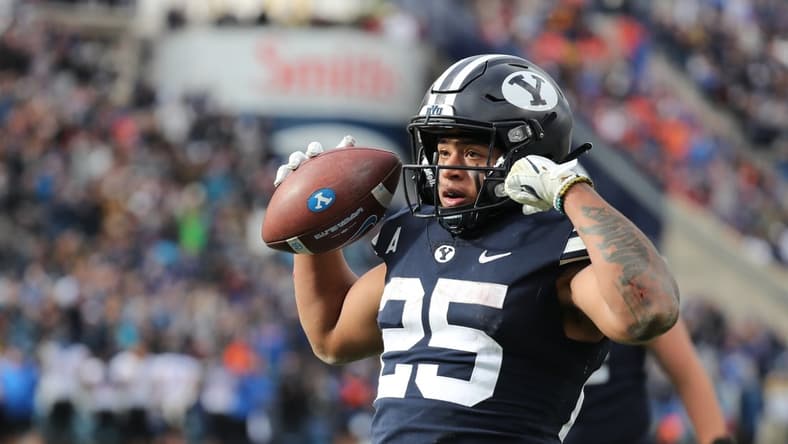 Oct 9, 2021; Provo, Utah, USA; Brigham Young Cougars running back Tyler Allgeier (25) reacts to scoring a touchdown in the fourth quarter at LaVell Edwards Stadium. Mandatory Credit: Rob Gray-USA TODAY Sports