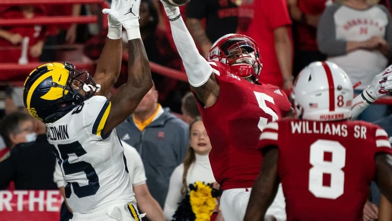 Oct 9, 2021; Lincoln, Nebraska, USA; Nebraska Cornhuskers cornerback Cam Taylor-Britt (5) breaks up a pass to Michigan Wolverines wide receiver Daylen Baldwin (85) during the second quarter at Memorial Stadium. Mandatory Credit: Dylan Widger-USA TODAY Sports