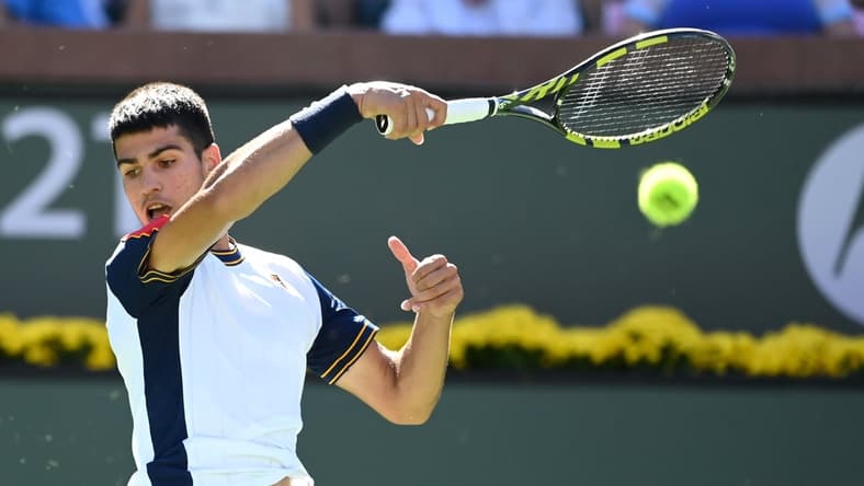 Oct 10, 2021; Indian Wells, CA, USA; Carlos Alcaraz (ESP) hits a shot during in his second round match against Andy Murray (GBR) in the BNP Paribas Open at the Indian Wells Tennis Garden. Mandatory Credit: Jayne Kamin-Oncea-USA TODAY Sports