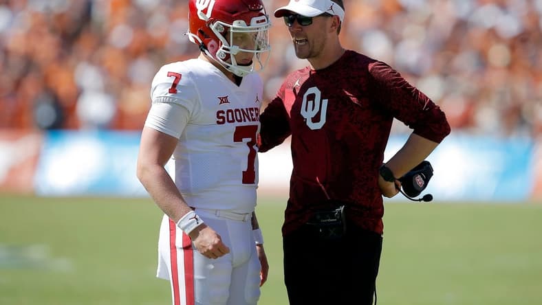 Oklahoma coach Lincoln Riley talks with Oklahoma's Spencer Rattler (7) before a two point-conversion attempt during the Red River Showdown college football game between the University of Oklahoma Sooners (OU) and the University of Texas (UT) Longhorns at the Cotton Bowl in Dallas, Saturday, Oct. 9, 2021.  Oklahoma won 55-48.

Ou Vs Texas