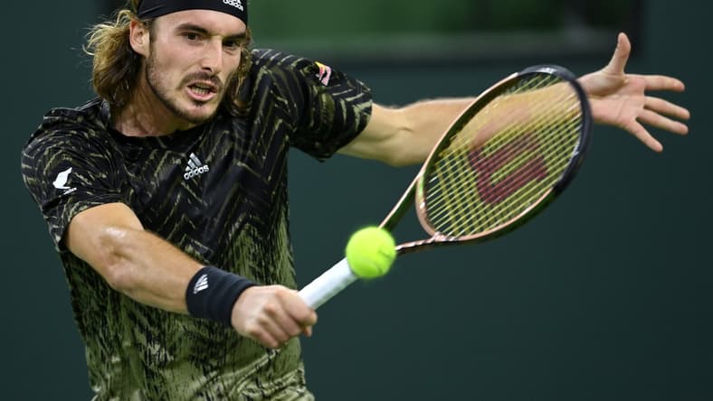 Oct 12, 2021; Indian Wells, CA, USA; Stefanos Tsitsipas (GRE) hits a shot against Fabio Fognini (ITA) during a third round match in the BNP Paribas Open at the Indian Wells Tennis Garden. Mandatory Credit: Jayne Kamin-Oncea-USA TODAY Sports