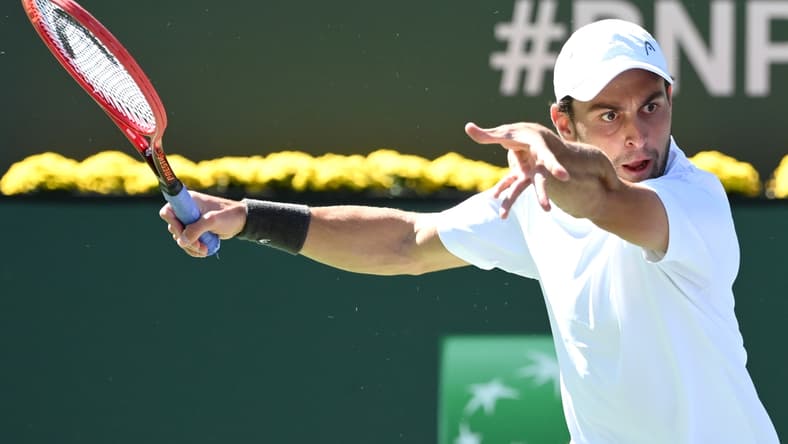 Oct 13, 2021; Indian Wells, CA, USA; Aslan Karatsev (RUS) gets set to hit a shot during his fourth round match against Hubert Hurkacz (POL) during the BNP Paribas Open at the Indian Wells Tennis Garden. Mandatory Credit: Jayne Kamin-Oncea-USA TODAY Sports