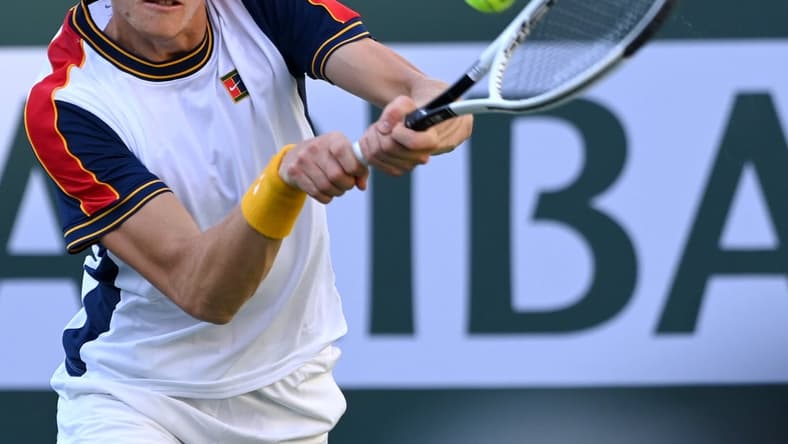 Oct 13, 2021; Indian Wells, CA, USA; Jannik Sinner (ITA) hits a shot against Taylor Fritz (USA) in their fourth round match during the BNP Paribas Open at the Indian Wells Tennis Garden. Mandatory Credit: Jayne Kamin-Oncea-USA TODAY Sports