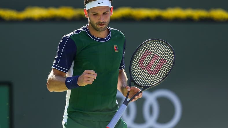 Grigor Dimitrov of Bulgaria celebrates a point against Daniil Medvedev of Russia during their round four match of the BNP Paribas Open, Wednesday, Oct. 13, 2021, in Indian Wells, Calif.