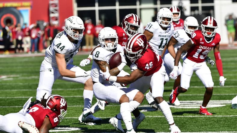 Oct 16, 2021; Bloomington, Indiana, USA; Michigan State Spartans wide receiver Jalen Nailor (8) is tackled by Indiana Hoosiers linebacker Aaron Casey (46) during the first quarter at Memorial Stadium. Mandatory Credit: Marc Lebryk-USA TODAY Sports