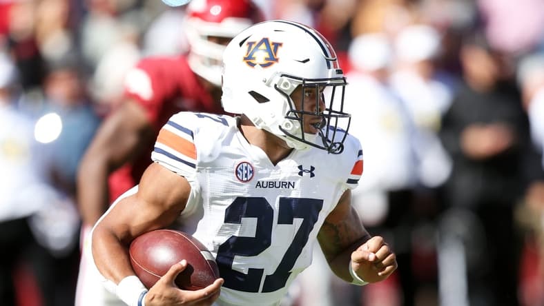 Oct 16, 2021; Fayetteville, Arkansas, USA; Auburn Tigers running back Jarquez Hunter (27) rushes during the first quarter against the Arkansas Razorbacks at Donald W. Reynolds Razorback Stadium. Mandatory Credit: Nelson Chenault-USA TODAY Sports