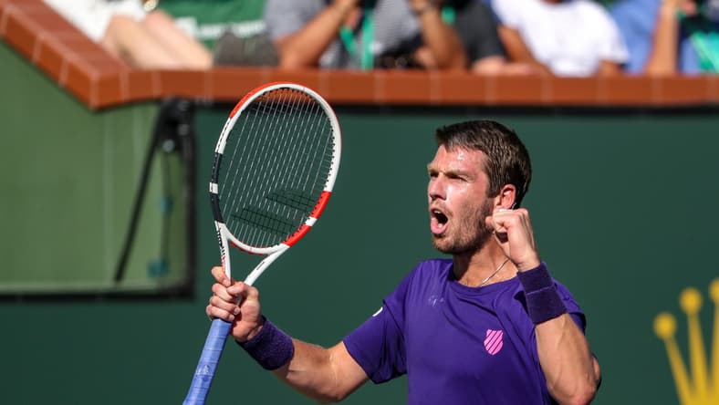 Cameron Norrie of Great Britain celebrates winning his semifinal match against Grigor Dimitrov of Bulgaria during the BNP Paribas Open at the Indian Wells Tennis Garden, Saturday, Oct. 16, 2021, in Indian Wells, Calif.