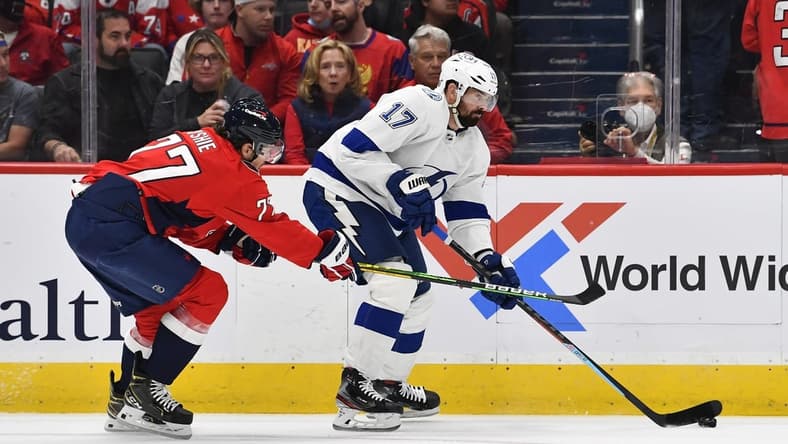 Oct 16, 2021; Washington, District of Columbia, USA; Tampa Bay Lightning left wing Alex Killorn (17) carries the puck as Washington Capitals right wing T.J. Oshie (77) defends during the first period at Capital One Arena. Mandatory Credit: Brad Mills-USA TODAY Sports