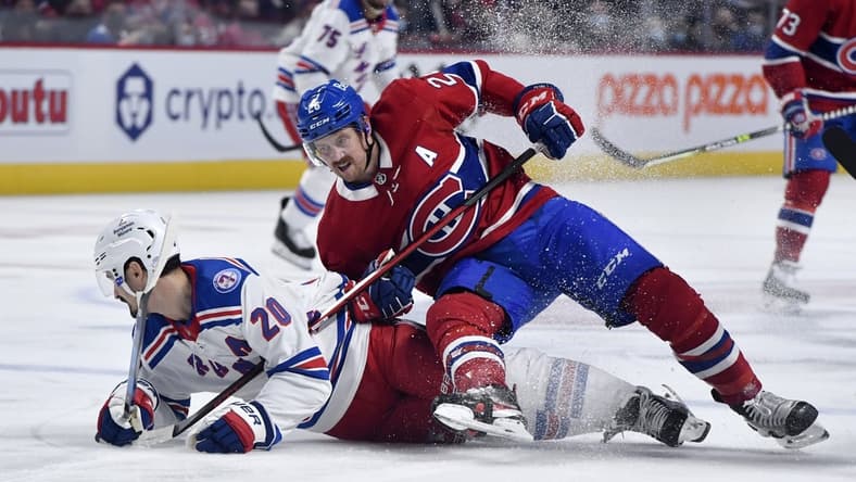Oct 16, 2021; Montreal, Quebec, CAN; Montreal Canadiens defenseman Jeff Petry (26) falls on top of New York Rangers forward Chris Kreider (20) during the first period at the Bell Centre. Mandatory Credit: Eric Bolte-USA TODAY Sports