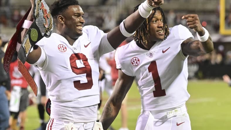 Oct 16, 2021; Starkville, Mississippi, USA; Alabama Crimson Tide defensive back Jordan Battle (9) and defensive back Kool-Aid McKinstry (1) react after defeating the Mississippi State Bulldogs at Davis Wade Stadium at Scott Field. Mandatory Credit: Matt Bush-USA TODAY Sports