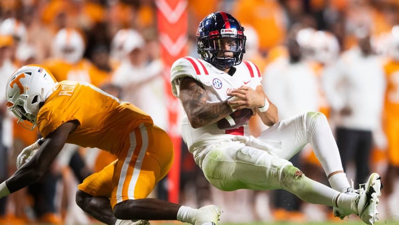 Mississippi quarterback Matt Corral (2) is knocked over by Tennessee defensive back Trevon Flowers (1) during an SEC football game between Tennessee and Ole Miss at Neyland Stadium in Knoxville, Tenn. on Saturday, Oct. 16, 2021.
Kns Tennessee Ole Miss Football