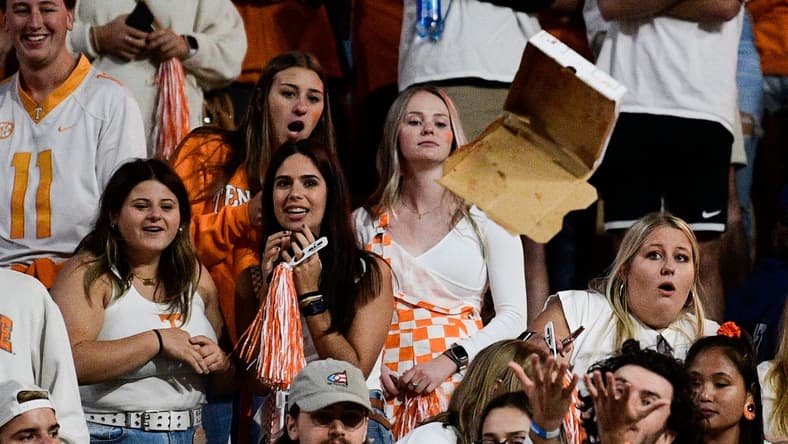 A pizza box is thrown onto the field from the stands after it was ruled that Jacob Warren was a yard short of the first down marker on a 4th and 24 play during an SEC football game between Tennessee and Ole Miss at Neyland Stadium in Knoxville, Tenn. on Saturday, Oct. 16, 2021. Tennessee fans littered the Neyland Stadium field with debris for several minutes following Ole Miss' game-clinching defensive stop with 54 seconds to play.

Kns Tennessee Ole Miss Football