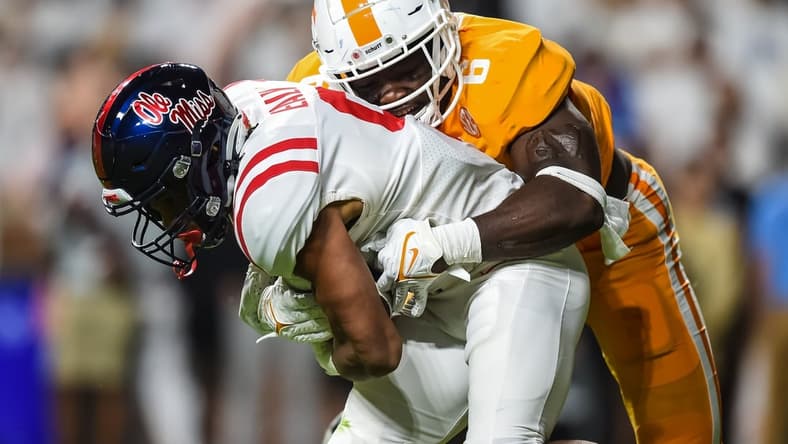 Oct 16, 2021; Knoxville, Tennessee, USA; Tennessee Volunteers linebacker Byron Young (6) tackles Mississippi Rebels running back Jerrion Ealy (9) during the first half at Neyland Stadium. Mandatory Credit: Bryan Lynn-USA TODAY Sports