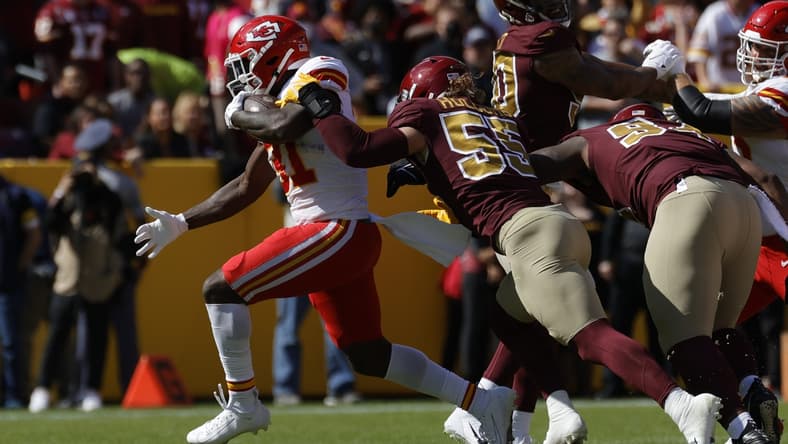 Oct 17, 2021; Landover, Maryland, USA; Kansas City Chiefs running back Darrel Williams (31) carries the ball as Washington Football Team linebacker Cole Holcomb (55) defends during the first quarter at FedExField. Mandatory Credit: Geoff Burke-USA TODAY Sports