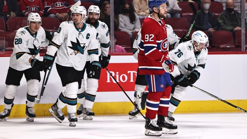 Oct 19, 2021; Montreal, Quebec, CAN; San Jose Sharks center Jonathan Dhalen (76) (left) celebrates his goal against the Montreal Canadiens with teammates during the first period as left wing Jonathan Drouin (92) passes on at Bell Centre. Mandatory Credit: Jean-Yves Ahern-USA TODAY Sports