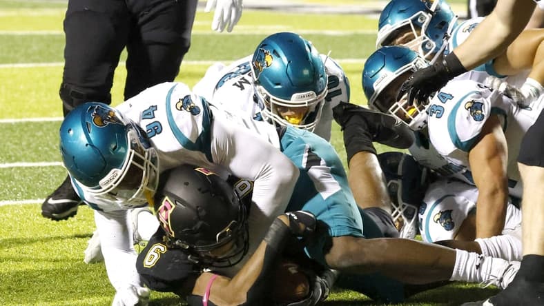 Oct 20, 2021; Boone, North Carolina, USA; Coastal Carolina Chanticleers linebacker Jeffrey Gunter (94) stops Appalachian State Mountaineers running back Camerun Peoples (6) at the one yard line during the second quarter at Kidd Brewer Stadium. Mandatory Credit: Reinhold Matay-USA TODAY Sports