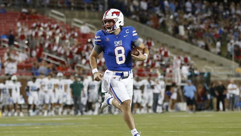 Oct 21, 2021; Dallas, Texas, USA; Southern Methodist Mustangs quarterback Tanner Mordecai (8) runs for a touchdown in the first quarter against the Tulane Green Wave at Gerald J. Ford Stadium. Mandatory Credit: Tim Heitman-USA TODAY Sports