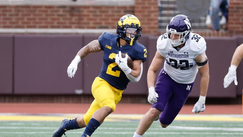 Oct 23, 2021; Ann Arbor, Michigan, USA;  Michigan Wolverines running back Blake Corum (2) rushes in the first half against the Northwestern Wildcats at Michigan Stadium. Mandatory Credit: Rick Osentoski-USA TODAY Sports