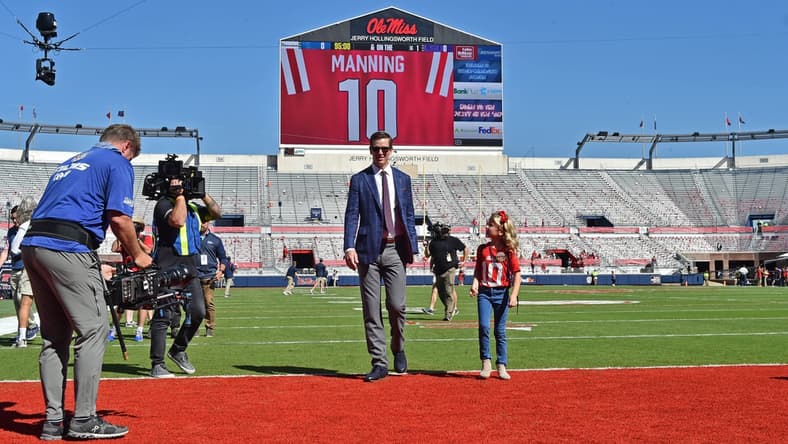Oct 23, 2021; Oxford, Mississippi, USA; Eli Manning with his family prior to the game between the Mississippi Rebels and the LSU Tigers at Vaught-Hemingway Stadium. Mandatory Credit: Justin Ford-USA TODAY Sports