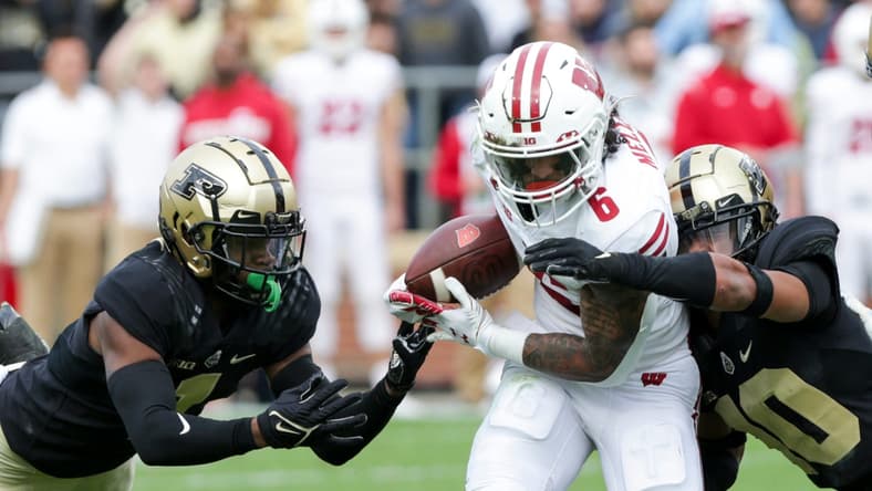 Purdue cornerback Dedrick Mackey (1) and Purdue safety Cam Allen (10) stop Wisconsin running back Chez Mellusi (6) during the first quarter of an NCAA college football game, Saturday, Oct. 23, 2021 at Ross-Ade Stadium in West Lafayette.

Cfb Purdue Vs Wisconsin