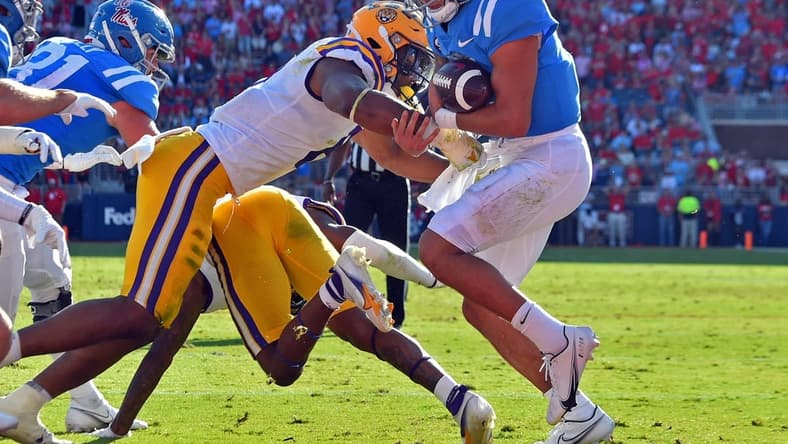 Oct 23, 2021; Oxford, Mississippi, USA; Mississippi Rebels quarterback Matt Corral (2) rushes for a touchdown during the first half against the LSU Tigers at Vaught-Hemingway Stadium. Mandatory Credit: Justin Ford-USA TODAY Sports