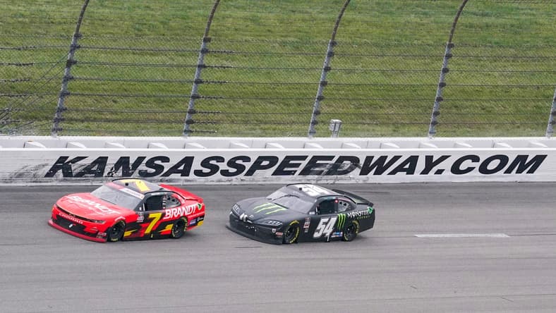 Oct 23, 2021; Kansas City, MO, USA; NASCAR Xfinity Series driver Justin Allgaier (7) and driver Ty Gibbs (54) round turn two during the Kansas Lottery 300 at Kansas Speedway. Mandatory Credit: Denny Medley-USA TODAY Sports