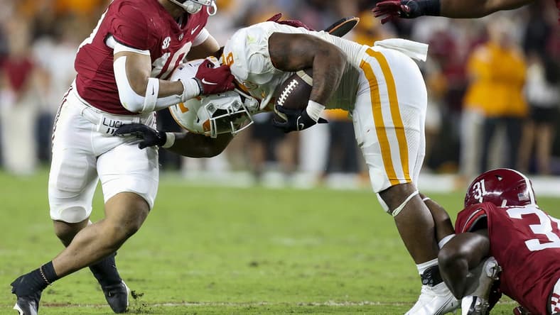 Oct 23, 2021; Tuscaloosa, Alabama, USA;  Tennessee Volunteers running back Tiyon Evans (8) is stopped by Alabama Crimson Tide linebacker Henry To'oTo'o (10) and linebacker Will Anderson Jr. (31) during the first half at Bryant-Denny Stadium. Mandatory Credit: Gary Cosby Jr.-USA TODAY Sports