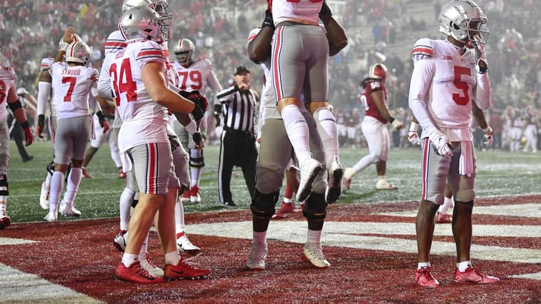 Oct 23, 2021; Bloomington, Indiana, USA; Ohio State Buckeyes tight end Jeremy Ruckert (88) is lifted to the air by a teammate  after a touchdown against the Indiana Hoosiers during the second quarter at Memorial Stadium. Mandatory Credit: Marc Lebryk-USA TODAY Sports