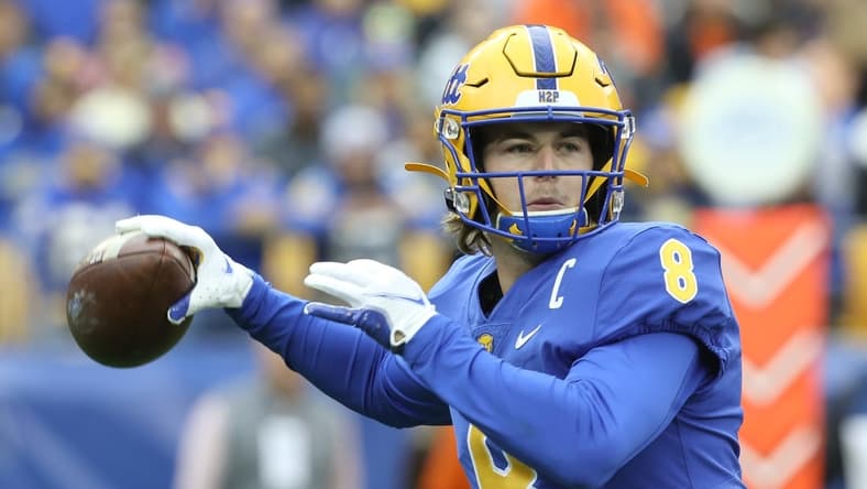 Oct 23, 2021; Pittsburgh, Pennsylvania, USA;  Pittsburgh Panthers quarterback Kenny Pickett (8) passes the ball against the Clemson Tigers during the first quarter at Heinz Field. Mandatory Credit: Charles LeClaire-USA TODAY Sports