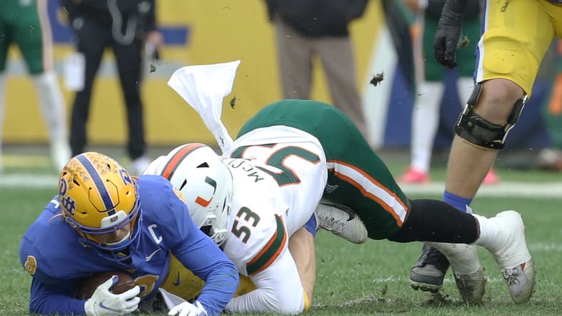 Oct 30, 2021; Pittsburgh, Pennsylvania, USA; Miami Hurricanes defensive lineman Zach McCloud (53) sacks Pittsburgh Panthers quarterback Kenny Pickett (8) during the first quarter at Heinz Field. Mandatory Credit: Charles LeClaire-USA TODAY Sports