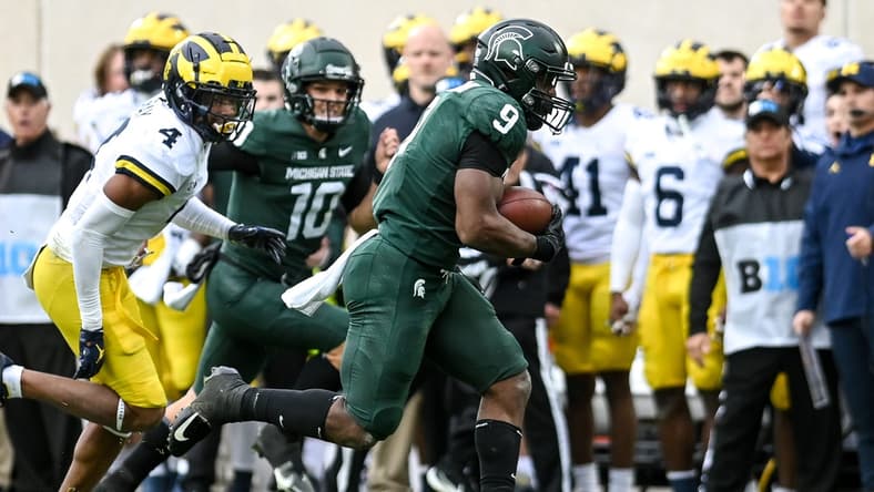Michigan State's Kenneth Walker III, right, runs for a touchdown as Michigan's Vincent Gray trails behind during the second quarter on Saturday, Oct. 30, 2021, at Spartan Stadium in East Lansing.

211030 Msu Michigan 084a