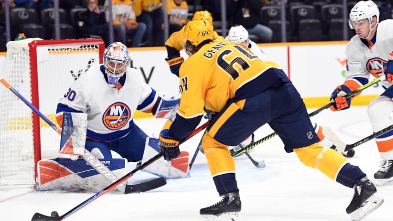 Oct 30, 2021; Nashville, Tennessee, USA; New York Islanders goaltender Ilya Sorokin (30) makes a save on a shot attempt from Nashville Predators center Mikael Granlund (64) during the first period at Bridgestone Arena. Mandatory Credit: Christopher Hanewinckel-USA TODAY Sports