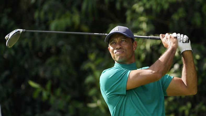 Nov 9, 2020; Augusta, Georgia, USA; Tiger Woods watch his hits his tee shot on the 14th hole during a practice round for The Masters golf tournament at Augusta National GC. Mandatory Credit: Michael Madrid-USA TODAY Sports