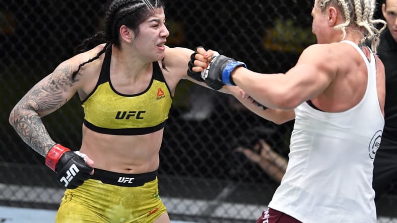 Feb 20, 2021; Las Vegas, NV, USA;  Ketlen Vieira of Brazil punches Yana Kunitskaya of Russia in a bantamweight bout during the UFC Fight Night event at UFC APEX on February 20, 2021 in Las Vegas, Nevada.  Mandatory Credit: Chris Unger/Handout Photo via USA TODAY Sports