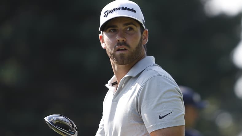 Jul 1, 2021; Detroit, Michigan, USA; Matthew Wolff watches after he tees off on the 17th hole during the first round of the Rocket Mortgage Classic golf tournament. Mandatory Credit: Raj Mehta-USA TODAY Sports