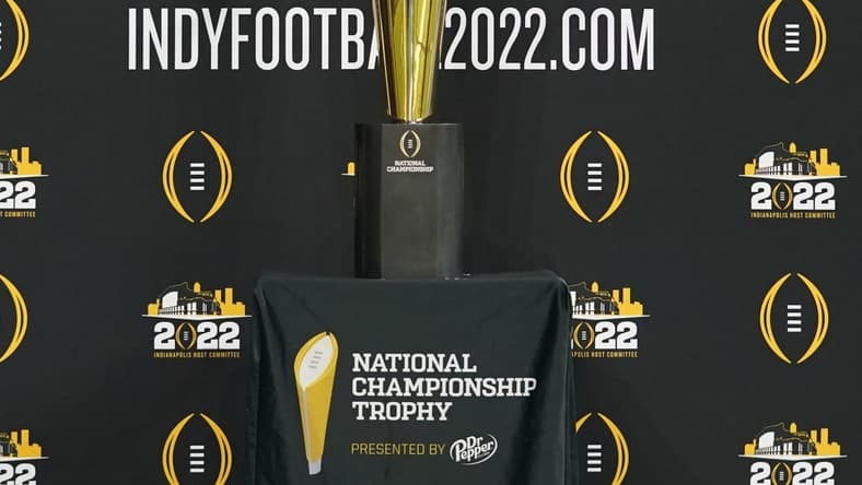 Jul 22, 2021; Indianapolis, Indiana, USA;  The College Football Playoff national championship trophy is displayed during Big 10 media days at Lucas Oil Stadium. Mandatory Credit: Robert Goddin-USA TODAY Sports