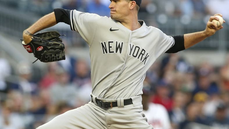 Aug 24, 2021; Atlanta, Georgia, USA; New York Yankees starting pitcher Andrew Heaney (38) throws against the Atlanta Braves in the first inning at Truist Park. Mandatory Credit: Brett Davis-USA TODAY Sports