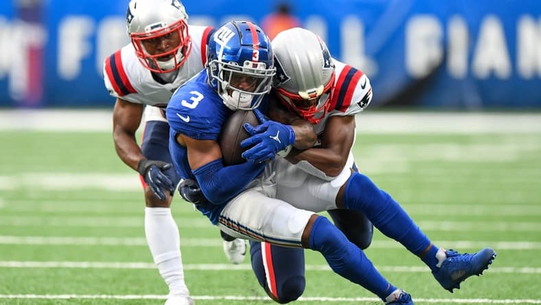 Aug 29, 2021; East Rutherford, New Jersey, USA; New England Patriots cornerback Mike Jackson (35) makes a tackles on New York Giants wide receiver Sterling Shepard (3) during the second quarte at MetLife Stadium. Mandatory Credit: Dennis Schneidler-USA TODAY Sports