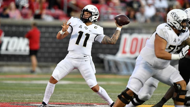 Sep 17, 2021; Louisville, Kentucky, USA;  UCF Knights quarterback Dillon Gabriel (11) looks to pass against the Louisville Cardinals during the first quarter at Cardinal Stadium. Louisville defeated Central Florida 42-35. Mandatory Credit: Jamie Rhodes-USA TODAY Sports