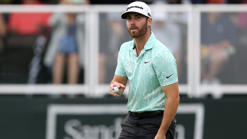Oct 2, 2021; Jackson, Mississippi, USA; Matthew Wolff acknowledges the crowd on the 18th green during the third round of the Sanderson Farms Championship at the Country Club of Jackson. Mandatory Credit: Chuck Cook-USA TODAY Sports