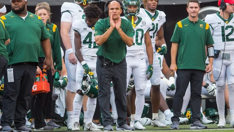 Oct 2, 2021; Stillwater, Oklahoma, USA;  Baylor Bears head coach Dave Aranda yells to his players on the field during the first quarter against the Oklahoma State Cowboys at Boone Pickens Stadium. Mandatory Credit: Brett Rojo-USA TODAY Sports