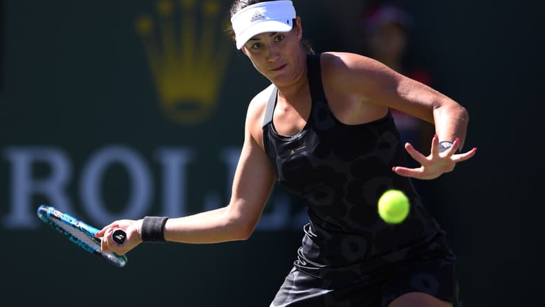 Oct 9, 2021; Indian Wells, CA, USA; Garbine Muguruza (ESP) hits a shot against Ajla Tomljanovic (AUS) at Indian Wells Tennis Garden. Mandatory Credit: Orlando Ramirez-USA TODAY Sports